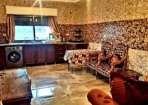 Kitchen (Small Table) & Living Room (4 Seats) + 4 extra chairs.