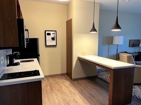 Desk, laptop workspace, blackout drapes, iron/ironing board