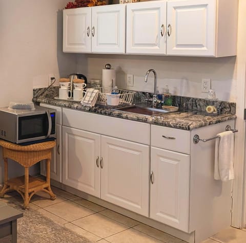 The kitchenette in Unit 2 has everything the Unit 1 kitchenette has.