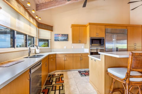 Appliances include a Wolfe range and Sub-Zero refrigerator.