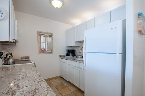 Enjoy a tastefully upgraded kitchen with modern appliances, ample counter space, and island-inspired style.