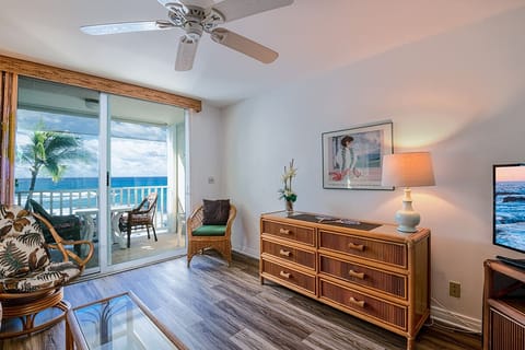 Spacious living area with breathtaking ocean views from both the sofa and windows. Central A/C keeps you cool while enjoying the sound of the waves.