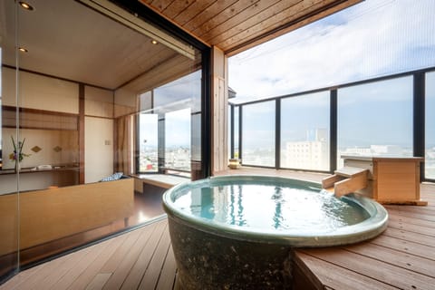 Combined shower/tub, free toiletries, hair dryer, slippers