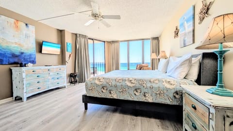 Master Bedroom with King bed and floor-to-ceiling windows and door to balcony overlooking Gulf and beaches.