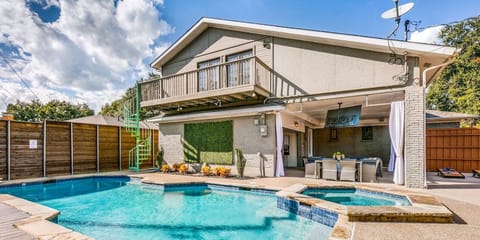 Large, fenced backyard area with a lot of privacy for your group stay! Enjoy the pool, hot tub, and lounging in the sun or shade. Watch TV while you grill, play games, or just enjoy dinner outside on a nice day.