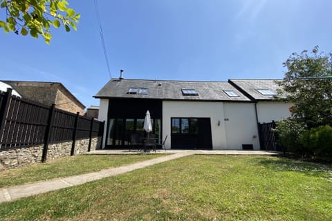 Hunters Moon, sleeping 4, has a terrace and enclosed lawned garden