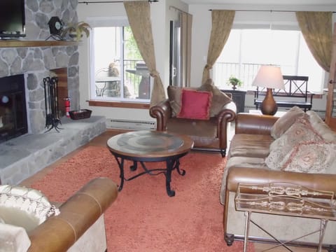 Living room with large flat screen TV with cable