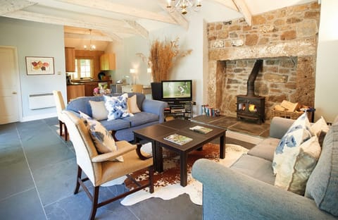 Ground floor: Open plan sitting room with wood burning stove and dining area