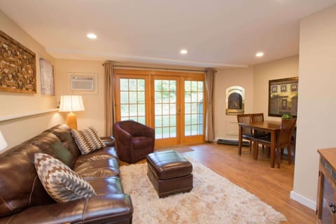 Cozy fireplace in living/dining area of condo at Topnotch Spa in Stowe