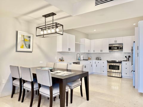 Bright, modern kitchen and dining area with sleek design
