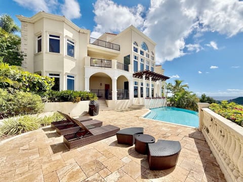 Sun-drenched patio with pool and stunning ocean views