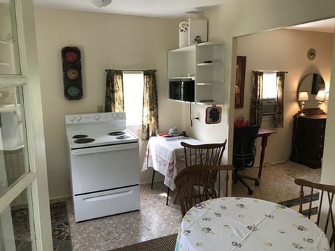 The garden cabin kitchen and bedroom