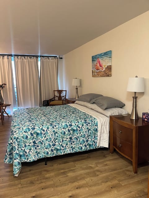 Bedroom with king size bed, and en suite bathroom