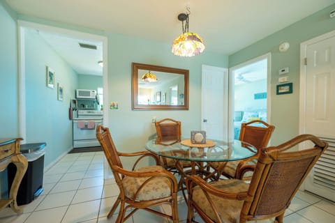 Dining with full kitchen to the left and bedroom 1 and full bath to the right