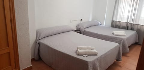 Blackout drapes, free WiFi, bed sheets