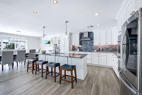 Flow-through design connecting kitchen, dining, and outdoor spaces—ideal for entertaining and easy vacation living