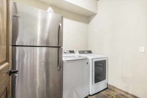 Laundry room with extra fridge (lower level)