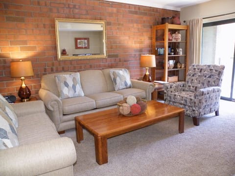 Living Room:  Q-sleeper sofa, love seat, fireplace (firelogs avail), Pvt balcony