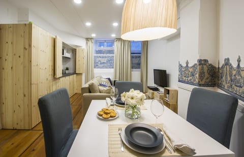Our beautiful living room with pinewood kitchenette, TV, sofa-bed & dining area