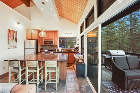 Kitchen and deck with peek lake views.