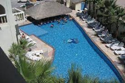 Outdoor pool, open 8:00 AM to 10:00 PM, free cabanas