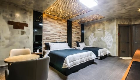 Twin Room (Disposable bed sheets, Bathtub) | Blackout drapes, iron/ironing board, free WiFi, bed sheets