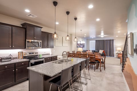 Kitchen Island - The Kitchen Island comfortably seats 4 adults and creates a great space for serving and preparing meals.