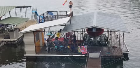 Park on side of bumper-lined dock, table, chairs, diving board on 2nd level...