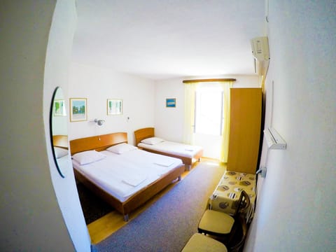 Triple Room | Desk, blackout drapes, free WiFi, bed sheets