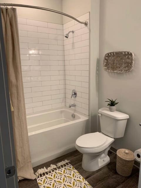 Master bathroom with shower tub combo and walk in closet. 