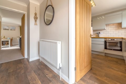 Ground floor: Entrance hallway leading to the kitchen