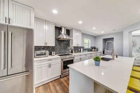 Totally updated opening kitchen with a microwave, dishwasher, stove, and oven