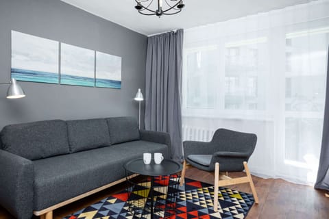 Living room with a comfortable sofa and TV. 