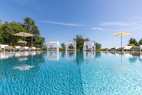 Outdoor pool, open 11:00 AM to 8:00 PM, pool umbrellas, sun loungers