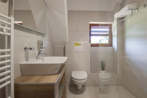 Double Room | Bathroom | Shower, hair dryer, slippers, towels