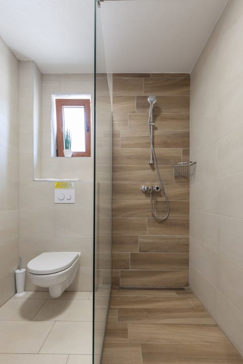 Double Room | Bathroom | Shower, hair dryer, slippers, towels