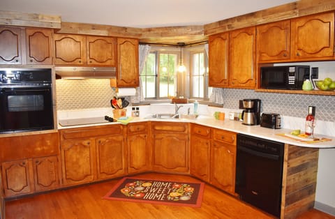 Open Kitchen: dishwasher, microwave, oven, cooktop, small appliances