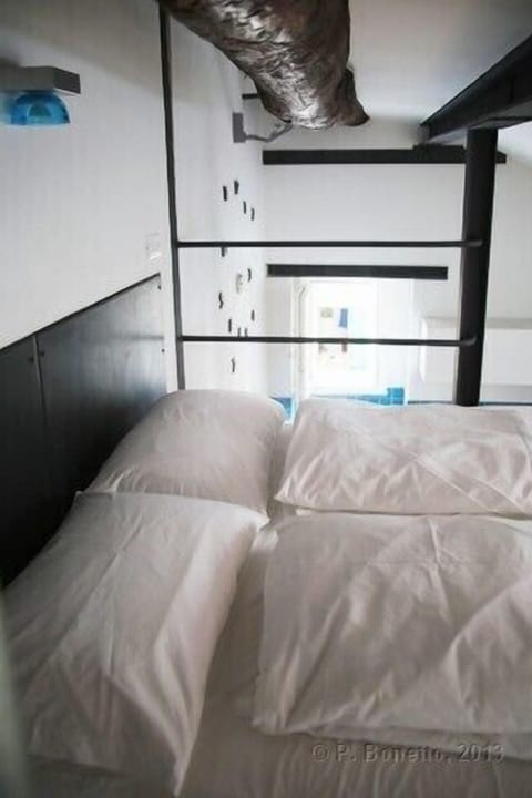 The double bed on the mezzanine