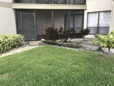 Back side screened patio; ground floor unit, only 1 shared wall
