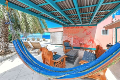 This private patio with a hammock only feet away from the beach is perfect for morning coffee or sunset drinks!