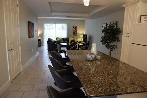 Comfort Townhome | Private kitchen | Full-size fridge, microwave, oven, stovetop