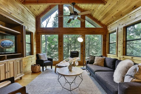 Living room with forest backdrop