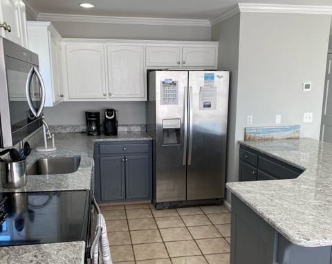 Updated kitchen, featuring new granite countertops.