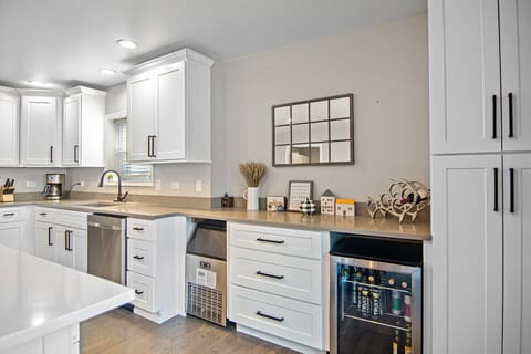 Commercial ice maker and wine fridge.