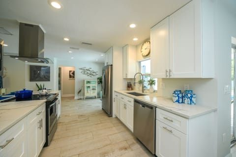 kitchen fully loaded with every conceivable small appliance