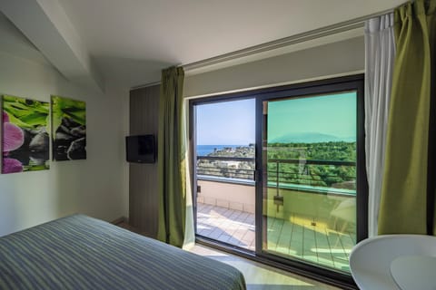 Family Room, Balcony, Lake View | Down comforters, minibar, in-room safe, individually decorated