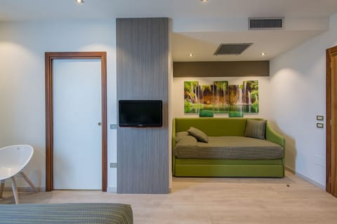 Superior Triple Room, Balcony, Partial Lake View | Down comforters, minibar, in-room safe, individually decorated