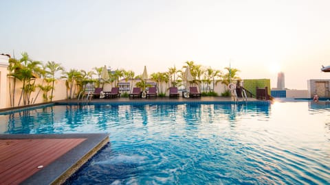Outdoor pool, open 7:30 AM to 8:30 AM, free cabanas, pool umbrellas