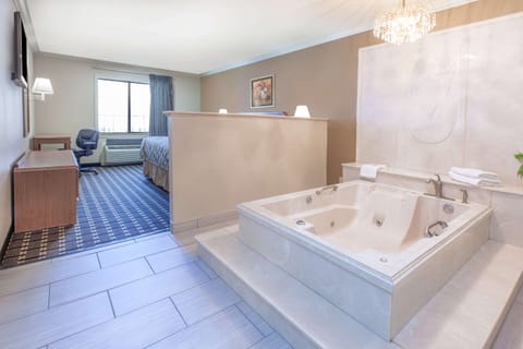 Suite, 1 Queen Bed, Non Smoking | Desk, iron/ironing board, WiFi (free), bed sheets