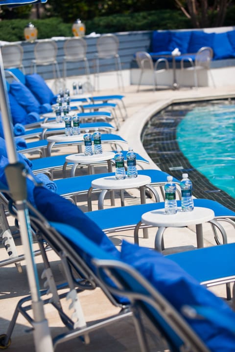 Outdoor pool, open 9:00 AM to 9:00 PM, pool umbrellas